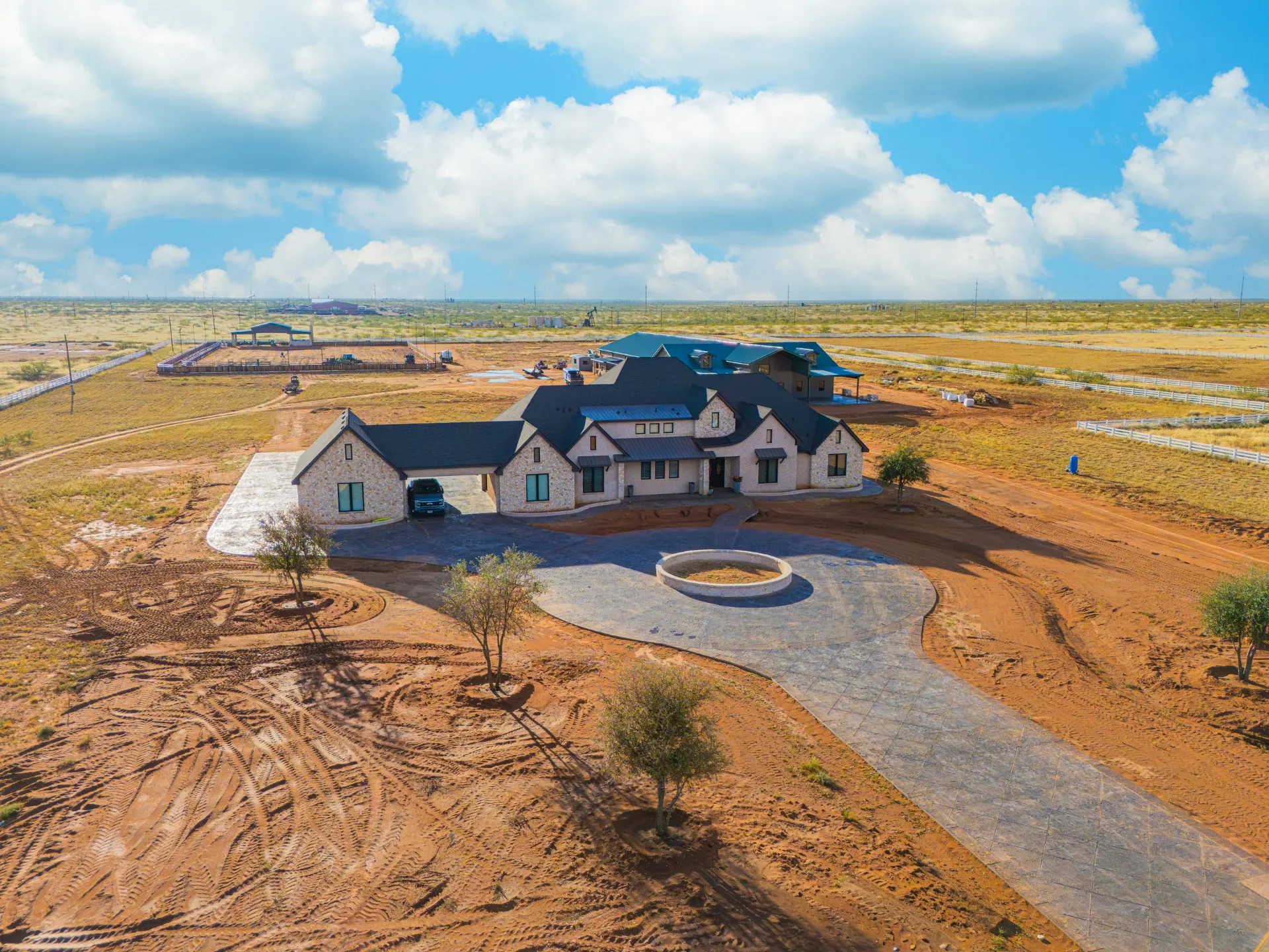 Aerial view of 5 Prairie Ln — stone and stucco estate on acreage outside Andrews, TX